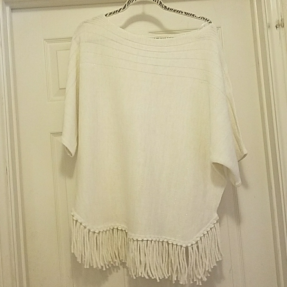 Beige and gold shirt with fringe at the bottom